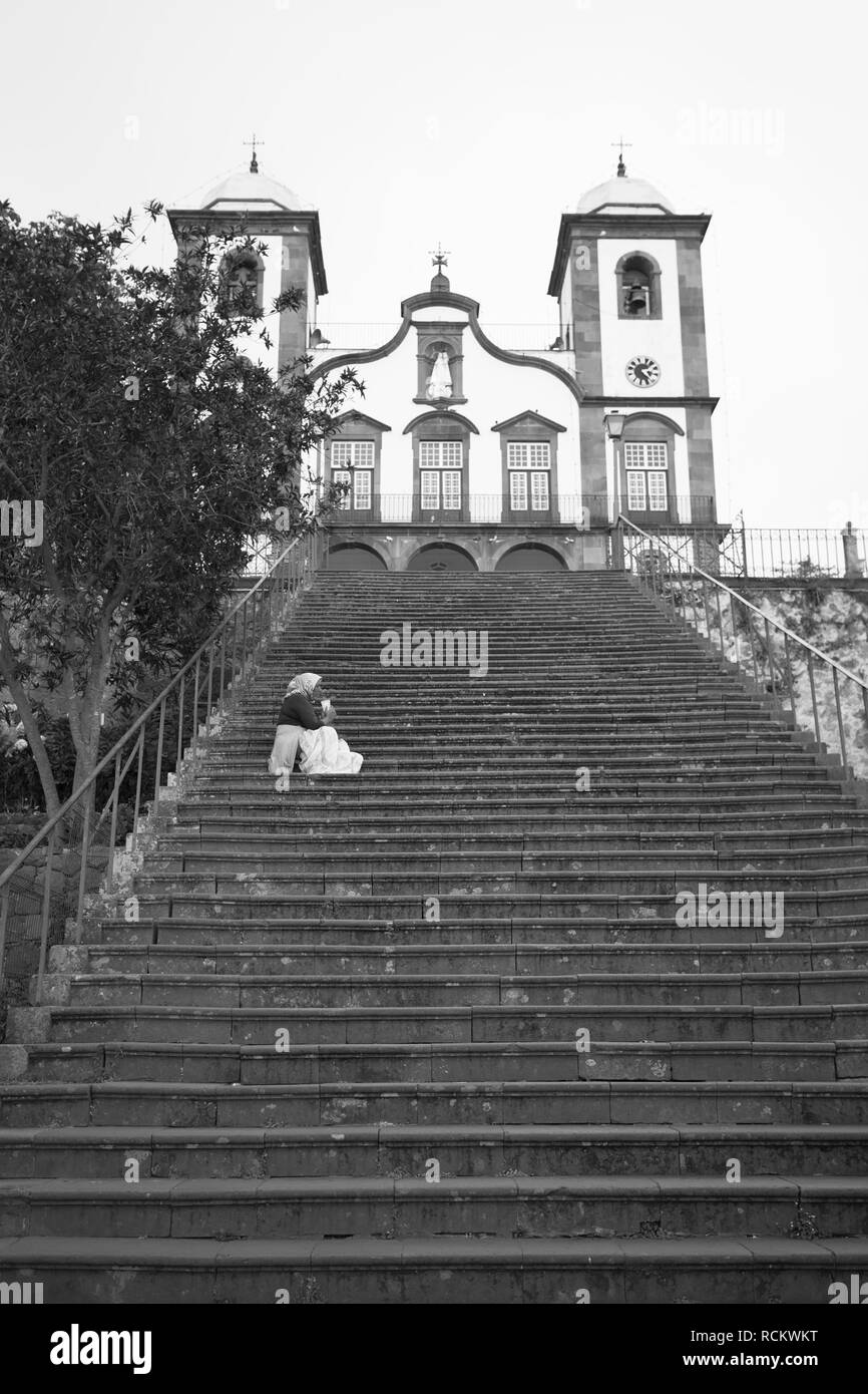 Homeless Lady on the Steps of the Church of our Lady, Funchal Stock Photo