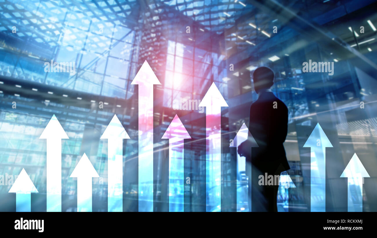 Up arrow graph on skyscraper background. Invesment and financial growth concept. Stock Photo