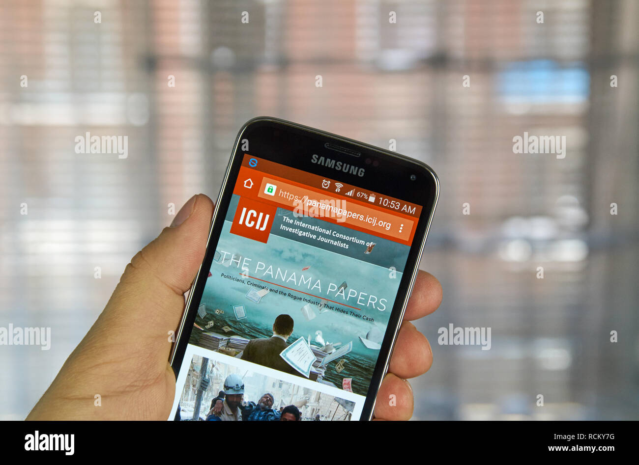 MONTREAL, CANADA - APRIL 5, 2016 : ICIJ web page on mobile phone. ICIJ is International Consortium of Investigative Journalists and well known for The Stock Photo