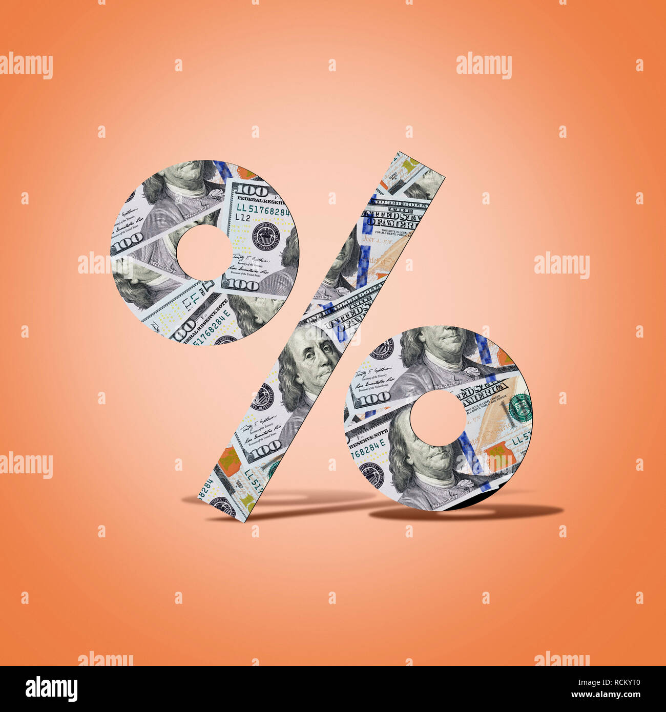 US dollar banknotes in shape of percentage sign, computer generated image, orange colour background Stock Photo