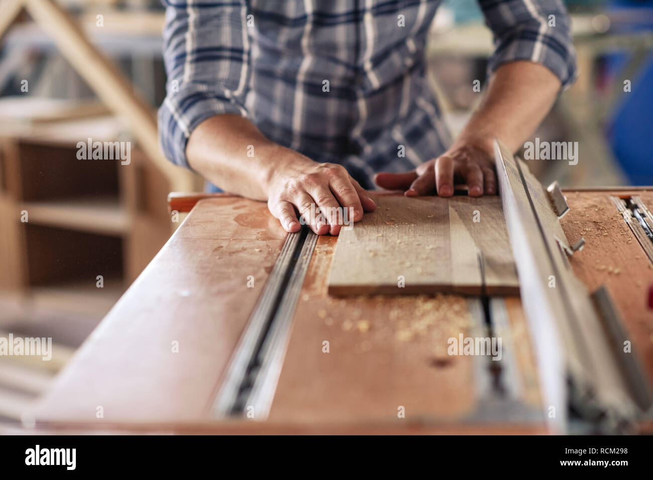 Woodworker making precision cuts with a table saw Stock Photo