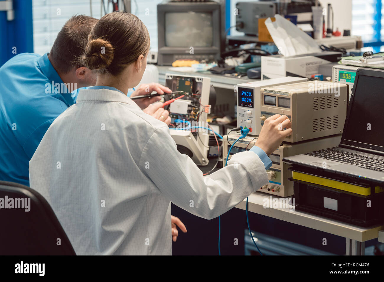 Team of electronic engineers testing a product prototype Stock Photo