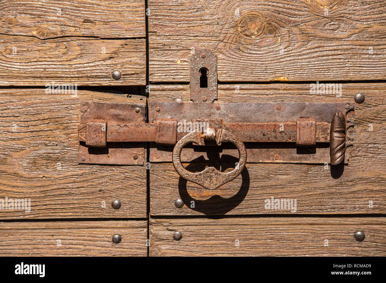 A old door lock in a rural village of the alps Stock Photo - Alamy