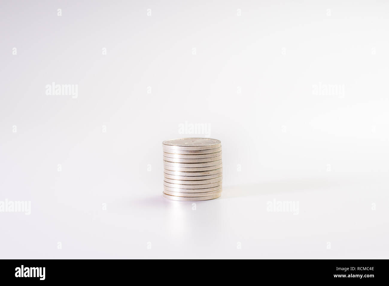 Stack of silver coins isolated on white background, industry Stock ...