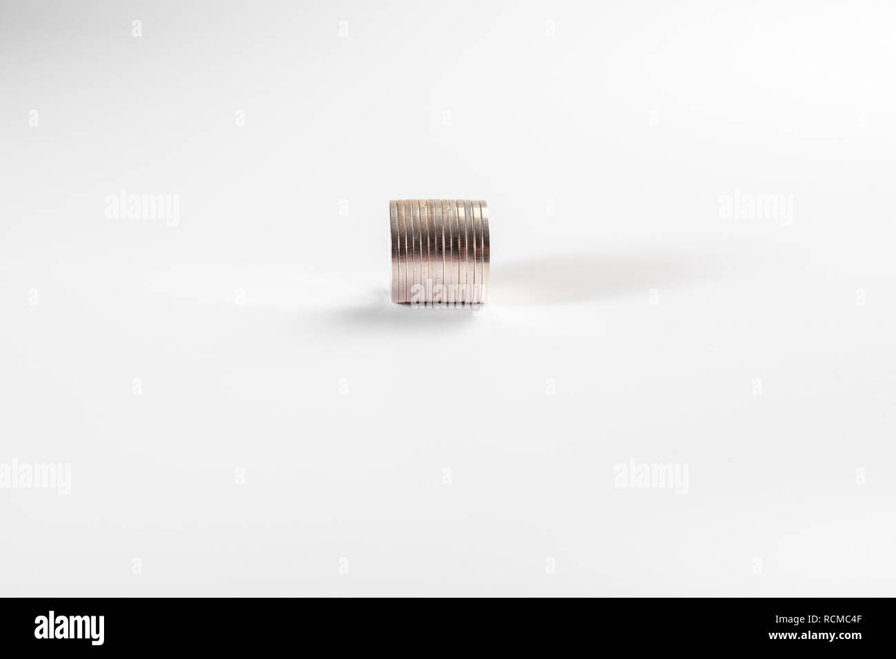 Stack of silver coins isolated on white background, industry Stock ...