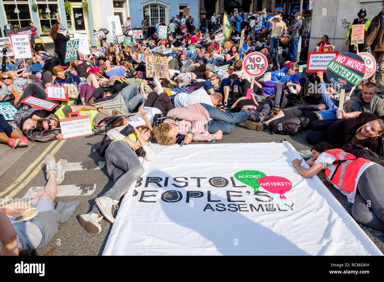 Bristol,UK, 8th July, 2015.Protesters are pictured as they take part in a mass die in during an anti austerity protest in Bristol Stock Photo