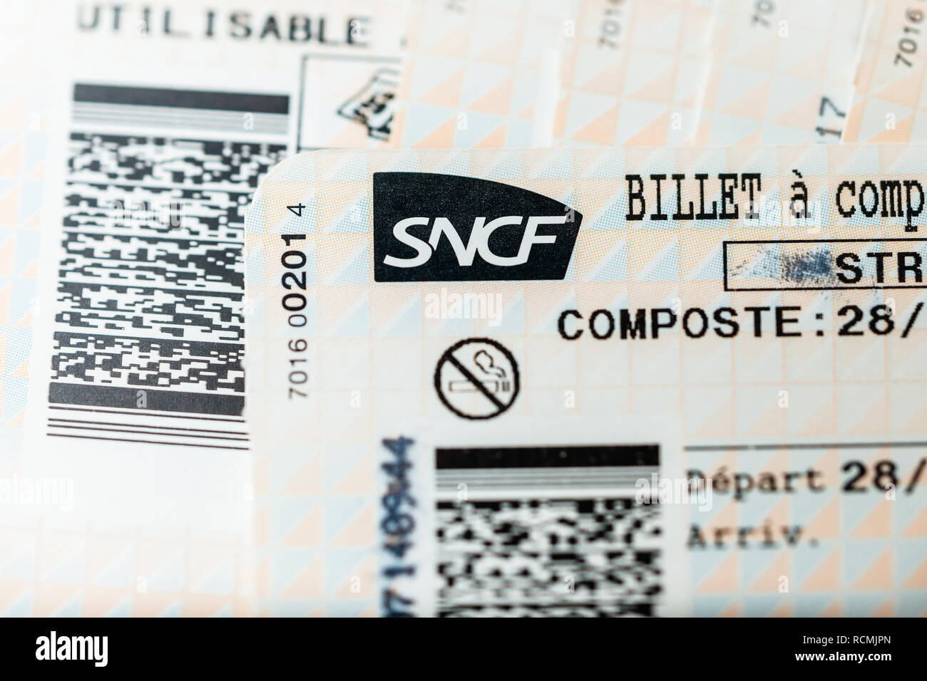 PARIS, FRANCE - JAN 14, 2015: Stack of multiple SNCF (Societe nationale des chemins de fer francais) train tickets seen from above randomly arranged on a table - close-up  Stock Photo