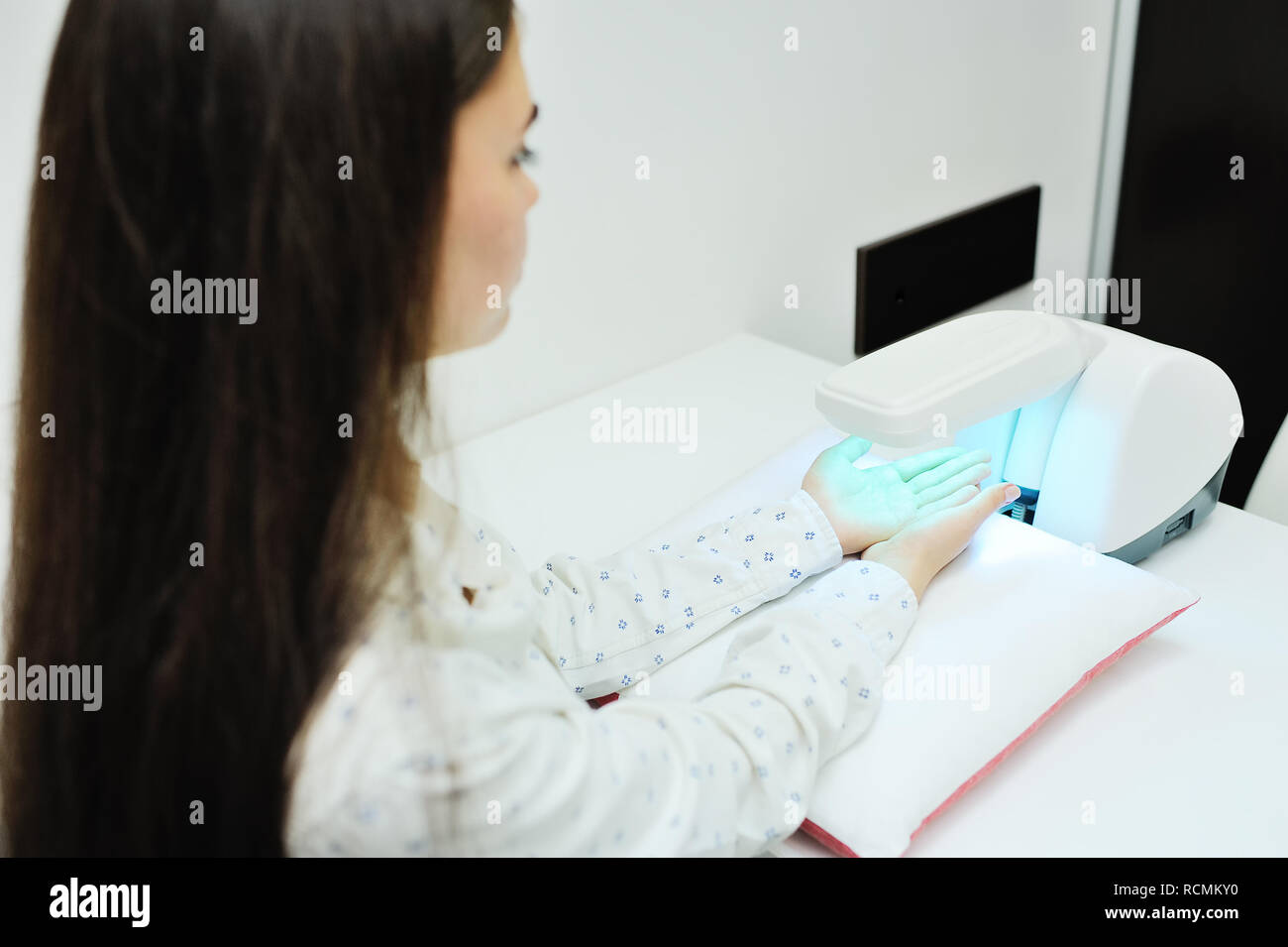 doctor spends psoriasis treatment using ultraviolet lamps and phototherapy. Stock Photo