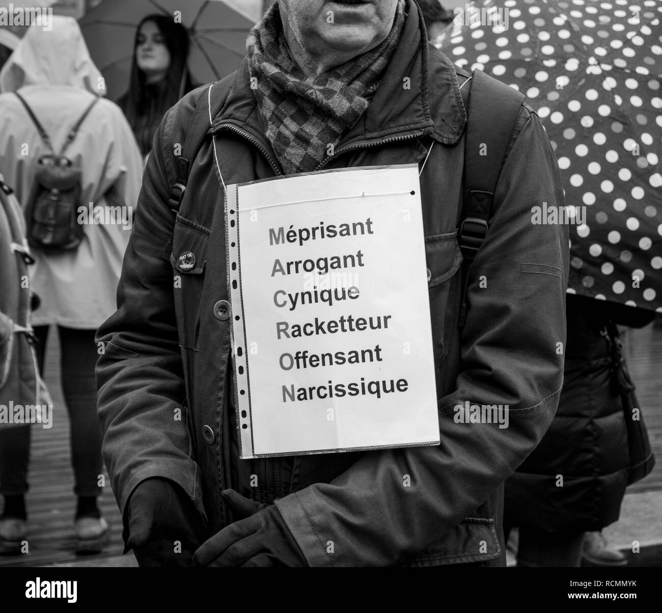 STRASBOURG, FRANCE  - MAR 22, 2018: Man wearing MACRON negative acronyme at demonstration protest against Macron French government string of reforms - black and white  Stock Photo