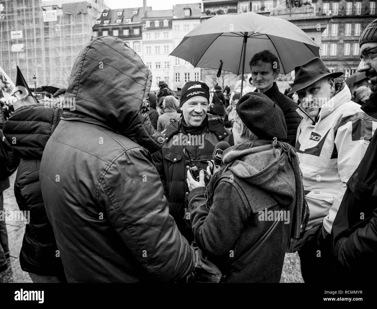 STRASBOURG, FRANCE  - MAR 22, 2018: France Bleu Radio Interviewing people at demonstration protest against Macron French government string of reforms, mutiple trade unions have called to strike  Stock Photo