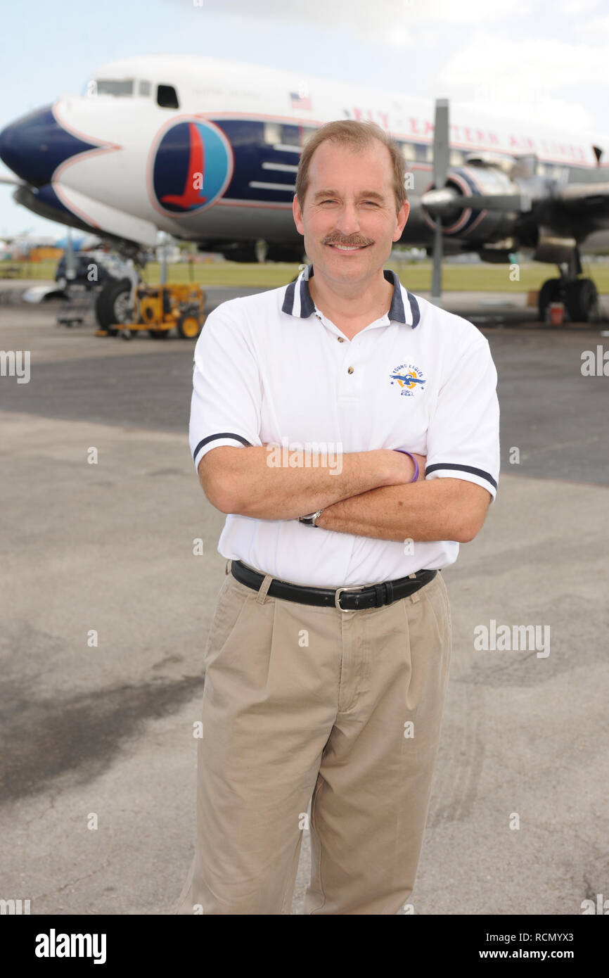 MIAMI, FL - NOVEMBER 17: Captain 'Sully' Sullenberger and Co-pilot Jeff Skiles pose with the Historical 1958 DC7 for a benefit hosted by Historical Flight Foundation. Chesley Burnett 'Sully' Sullenberger, III (born January 23, 1951) is a retired airline captain and aviation safety consultant. He was hailed as a national hero in the United States when he successfully executed an emergency water landing of US Airways Flight 1549 in the Hudson River off Manhattan, New York City, after the aircraft was disabled by striking a flock of Canada geese during its initial climb out of LaGuardia Airport o Stock Photo