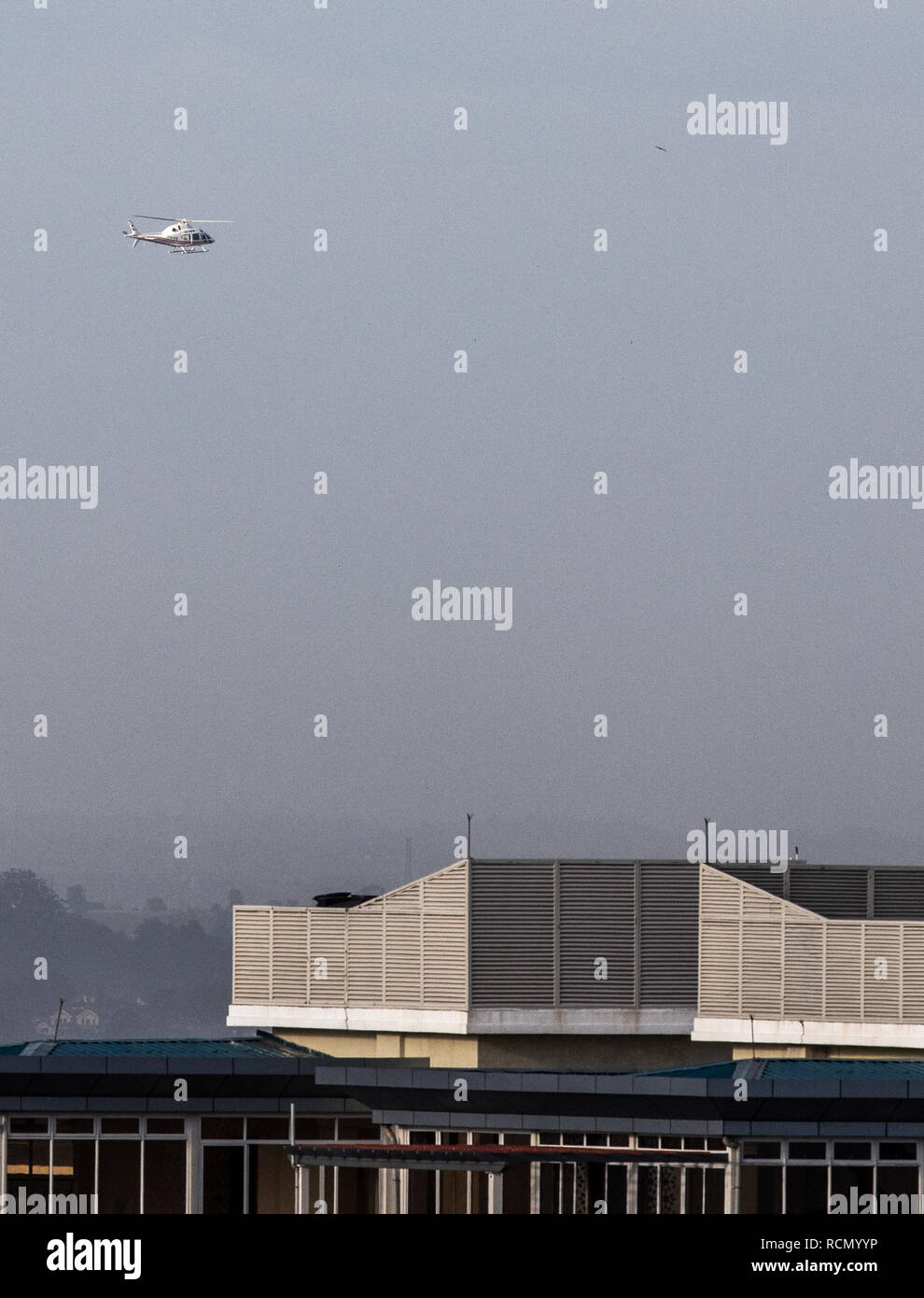 Nairobi, Kenya. 15th Jan, 2019. A helicopter hovers near the site of an attack at an upmarket hotel and office complex in Nairobi, Kenya, on Jan. 15, 2019. At least three people have been confirmed dead and several others injured following an attack at an upmarket hotel and office complex in Nairobi on Tuesday, police said. Credit: Zhang Yu/Xinhua/Alamy Live News Stock Photo