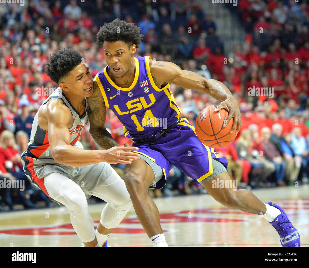 Oxford, MS, USA. 15th Jan, 2019. LSU guard, Marlon Taylor (14), drives tot  the hoop against Ole' Miss guard, Breein Tyree (4), during the NCAA  basketball game between the LSU Tigers and