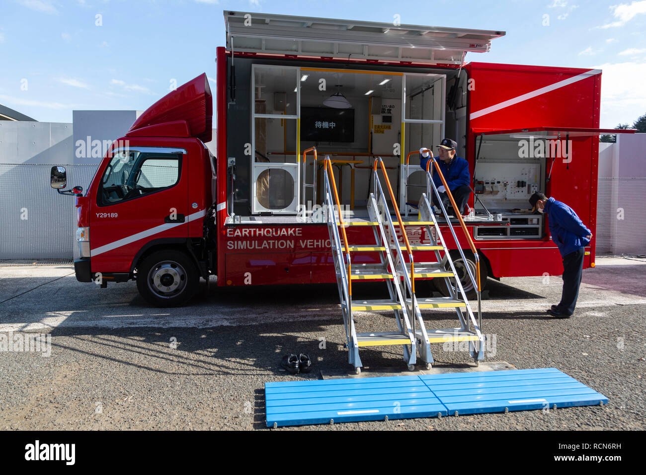 An earthquake simulator vehicle on display during the Disaster Preparedness Drill for Foreign Residents in FY2018 at Komazawa Olympic Park General Sports Ground on January 16, 2019, Tokyo, Japan. About 263 participants (including Tokyo foreign residents and members of embassies and international organizations) were instructed how to protect themselves in case of earthquake disaster by the Tokyo Fire Department with the assistance of volunteer interpreters in English, Chinese, Spanish and French. Participants learned how to give chest compression, shelter's rules life and experienced the shakin Stock Photo