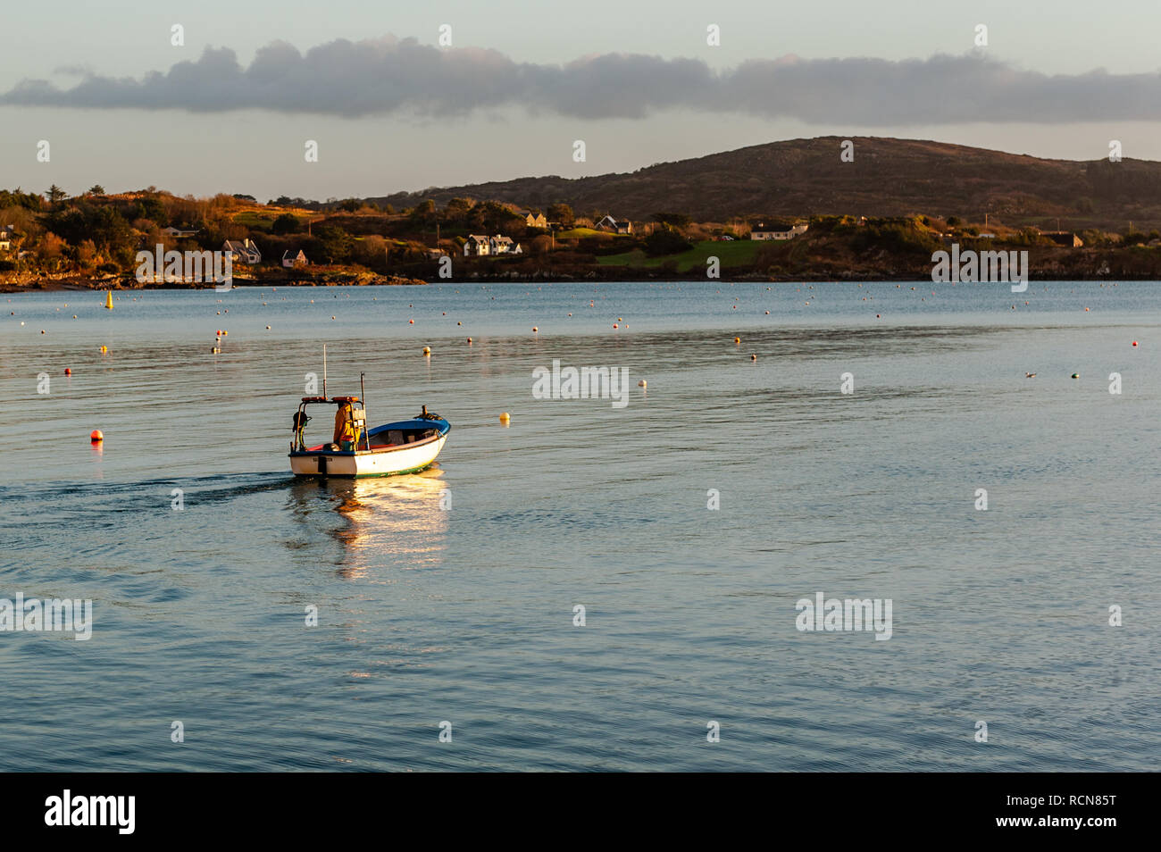 Schull, West Cork, Ireland. 16th Jan, 2019. A local fisherman sails away from Schull Harbour to haul his crab pots which have been soaking for a number of days. Met Eireann has put a yellow wind warning in place for counties Cork and Kerry from 12.00 to 17.00 today. Wind will reach mean speed between 50 to 65 km/h with gusts of up to 90km/h. Credit: AG News/Alamy Live News Stock Photo