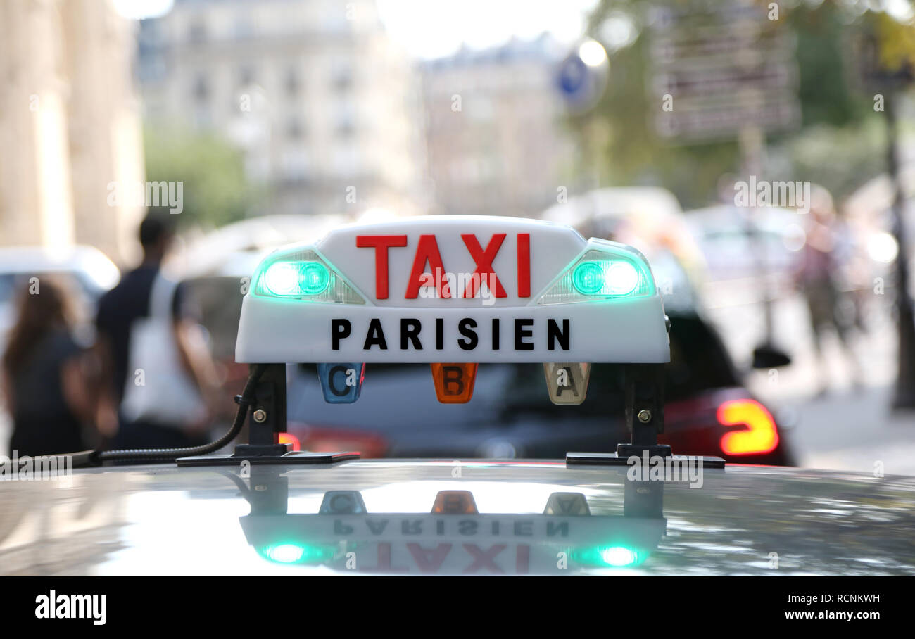 French taxi text with lights in the capital of France in Europe Stock Photo Alamy