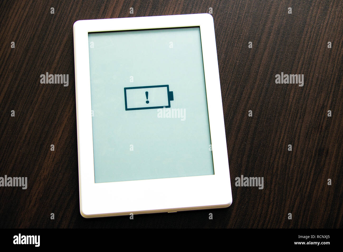 Low battery message on the portable book Stock Photo Alamy