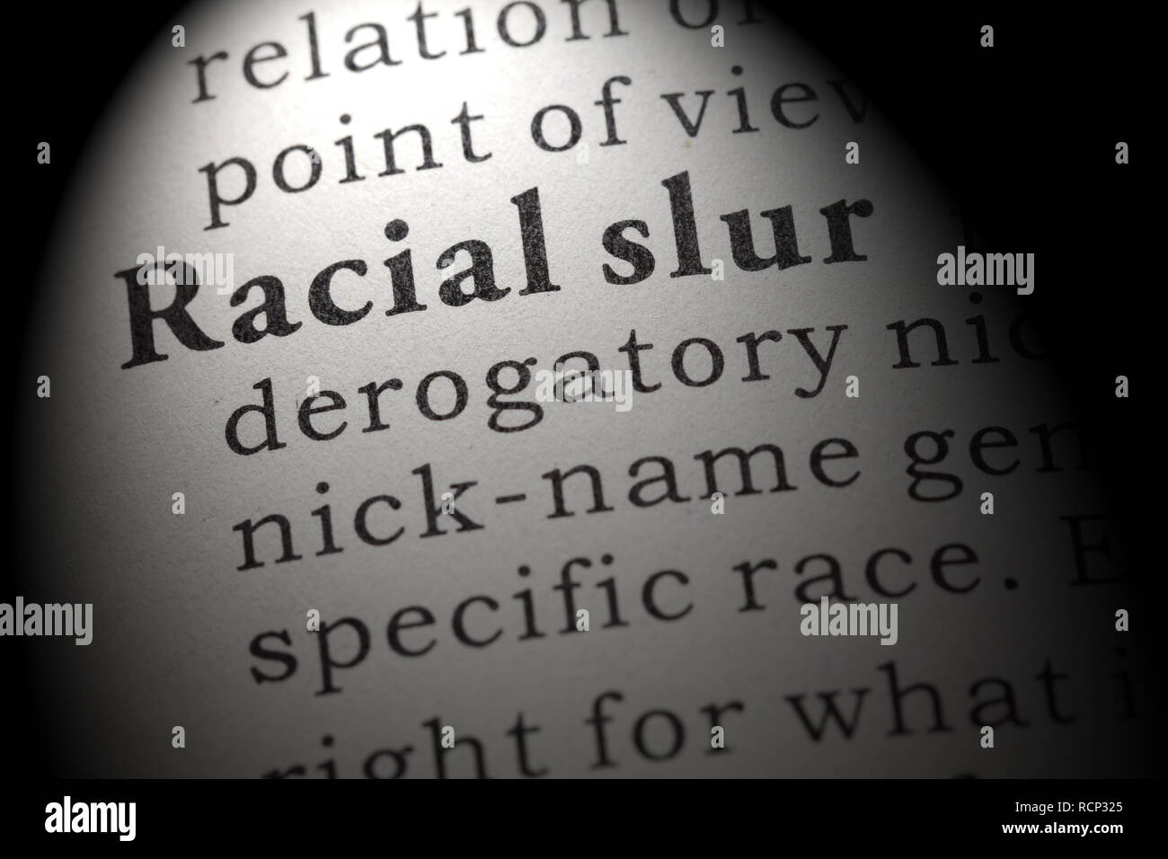 Fake Dictionary, Dictionary definition of the word racial slur. including key descriptive words. Stock Photo