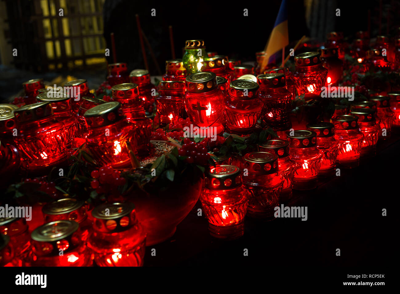 Red candles at night near the holodomor memorial in Ukraine Stock Photo