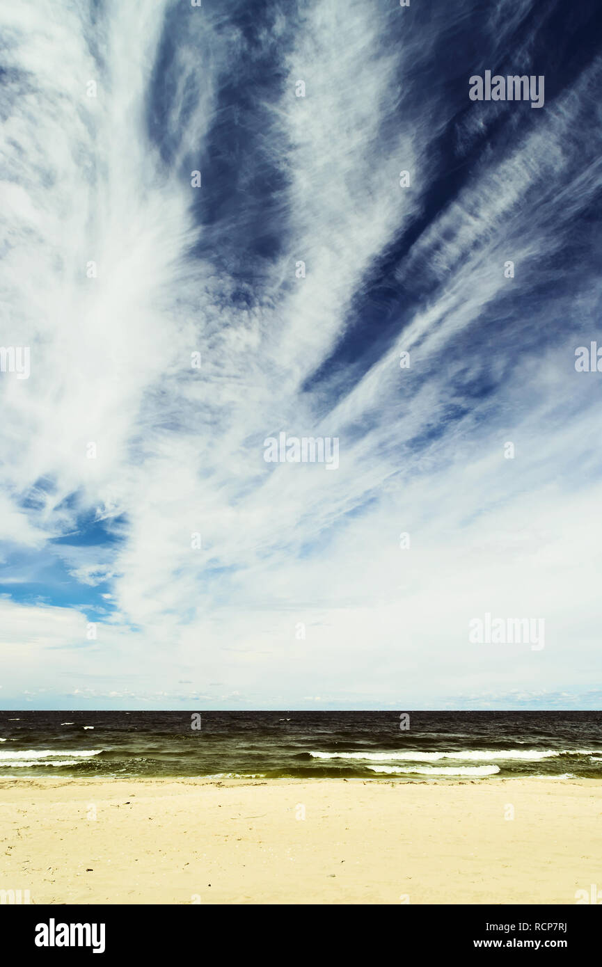 Landscape with stratocumulus clouds on the sky over the Baltic sea beach. Stegna, Pomerania, Poland. Stock Photo