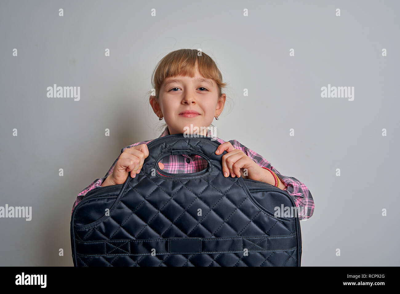 girl with briefcase on white background Stock Photo Alamy