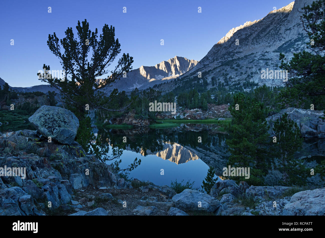 reflection of Mount Goode in Long Lake near Bishop California Stock Photo