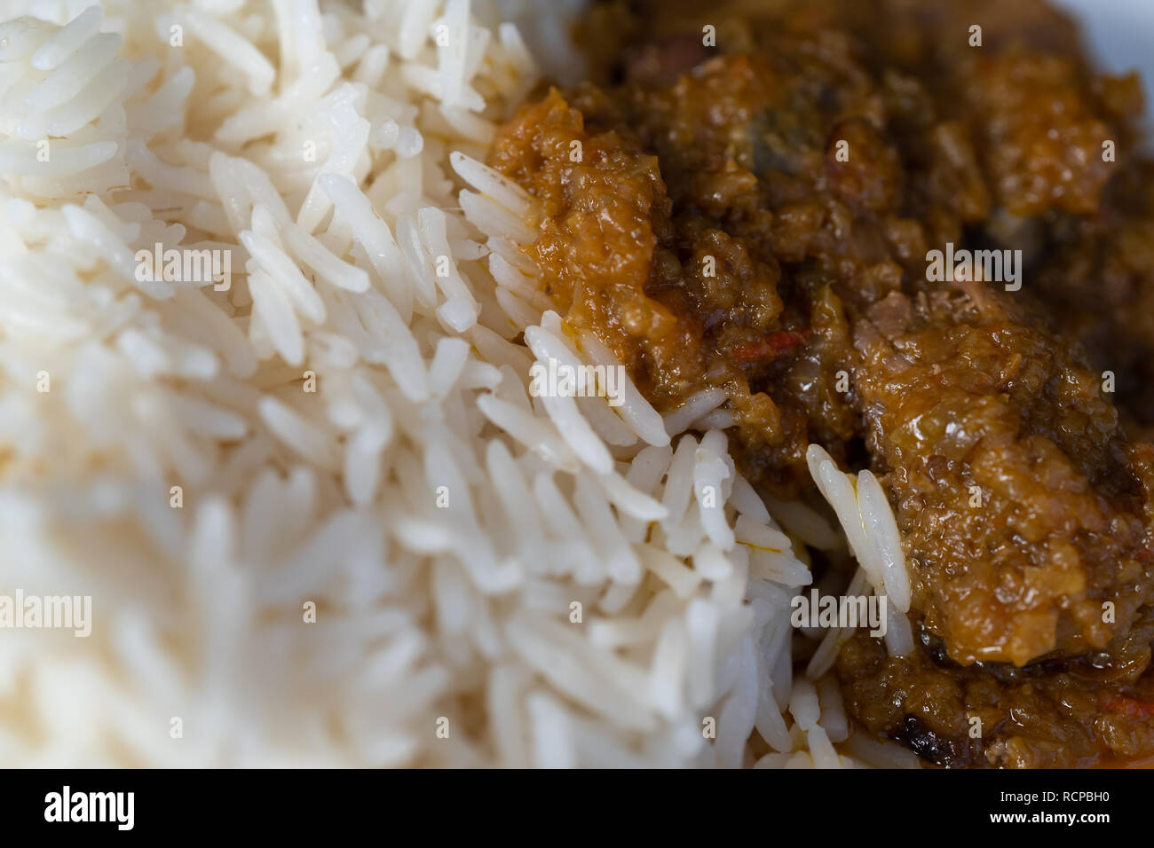 White boiled rice with spicy ofada stew a Nigerian traditional meal ...