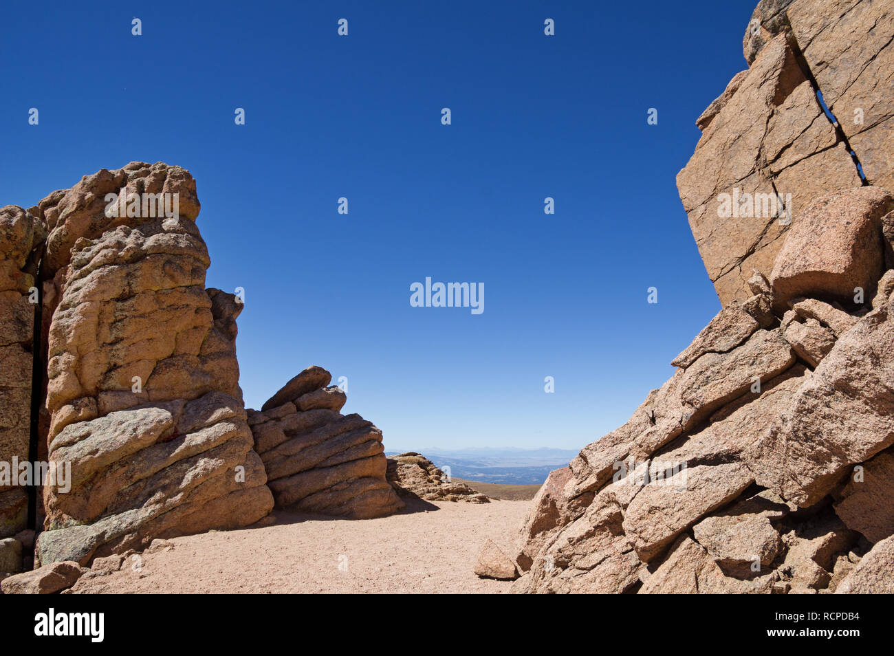 path through some tall rocks on the trail up to Pikes Peak in Colorado ...