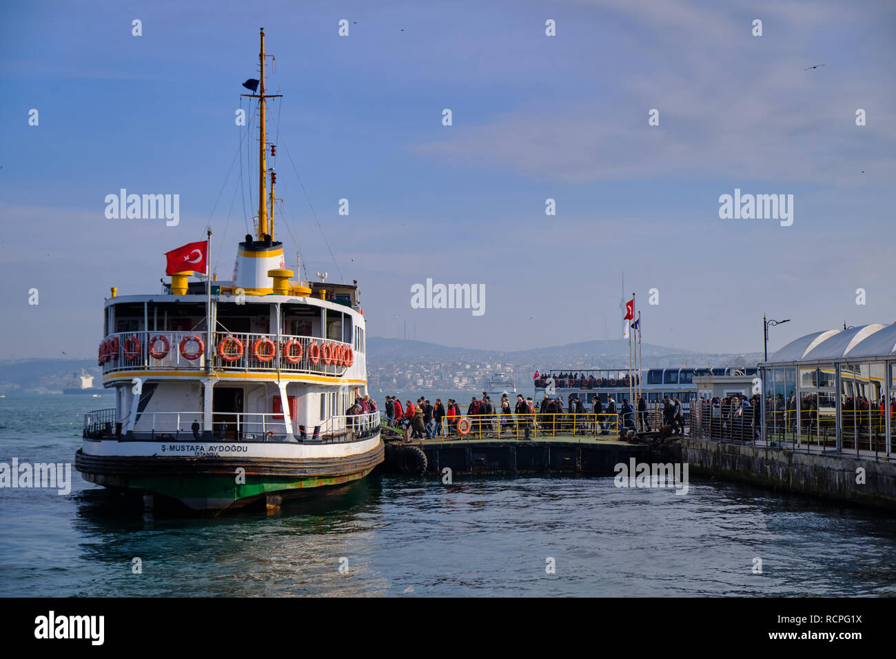 Istanbul, Turkey:  People boarding the ferry at Eminonu station effectively leaving Europe, to Asia by crossing the Bosphorus Stock Photo