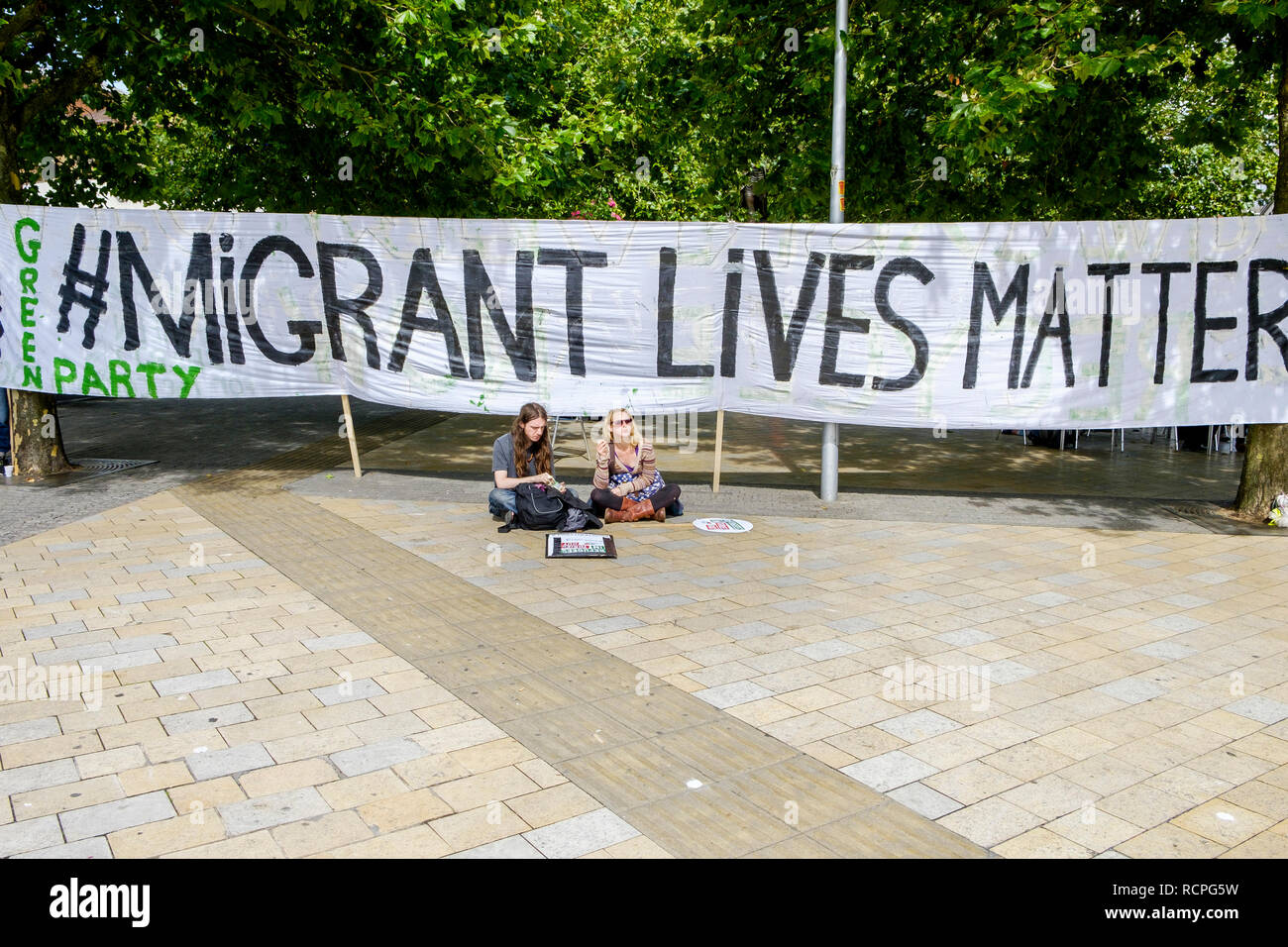 Protesters carrying placards are pictured marching through Bristol during a protest demonstration march and rally in support of refugees. 12/09/2015 Stock Photo