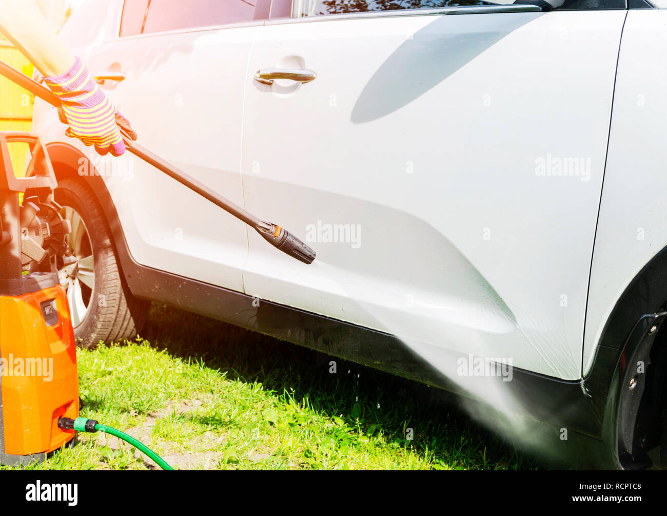 Manual car wash with pressurized water in car wash outside. Summer Car