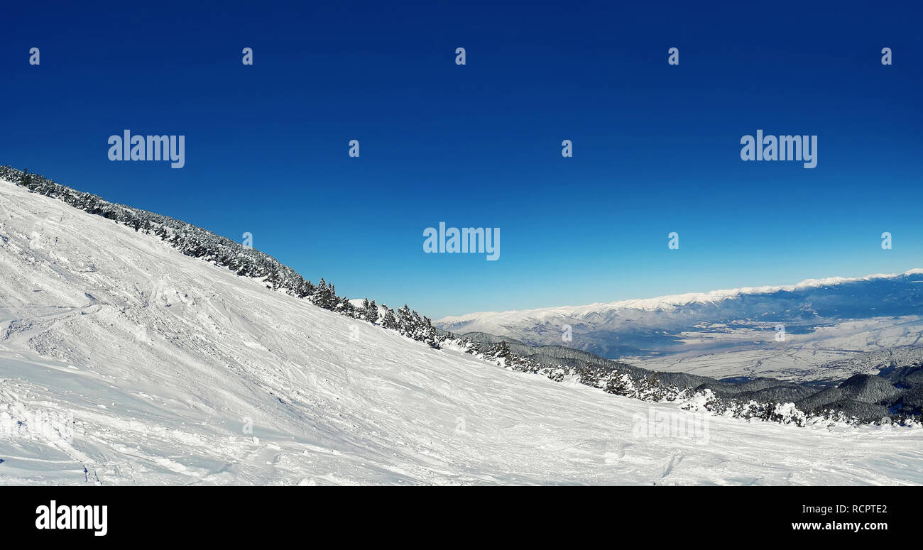 Mass downhill skiing on Todorka mountain, Bansko ski resort, Bulgaria Stock Photo