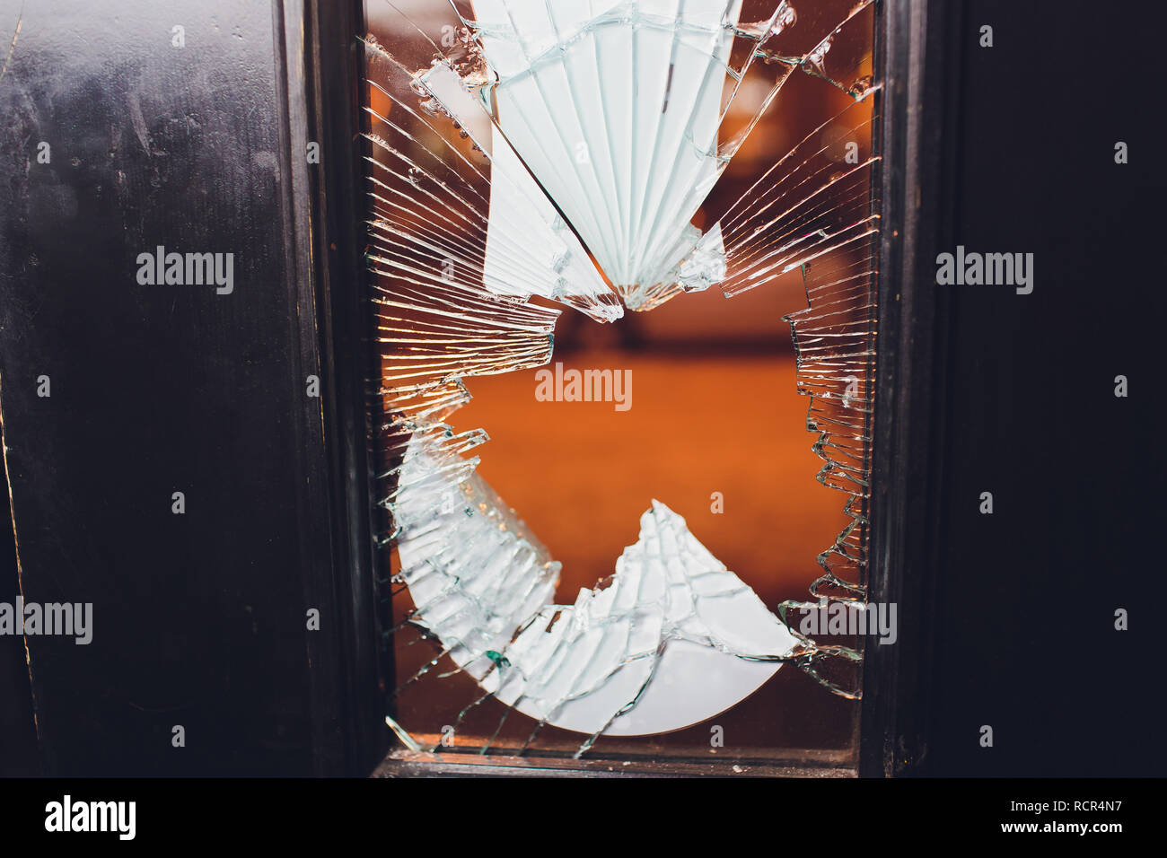 Broken glass black door of the shop. Stock Photo