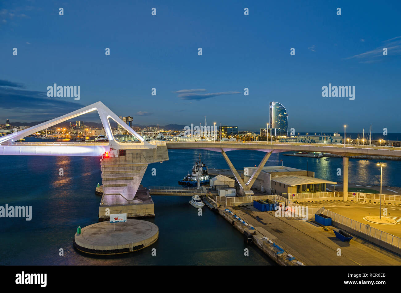 Barcelona, Spain - November 10, 2018: Port Vell with its cruise terminal, bascule bridge Porta d'Europa, helicopter pad and W Barcelona, also known as Stock Photo