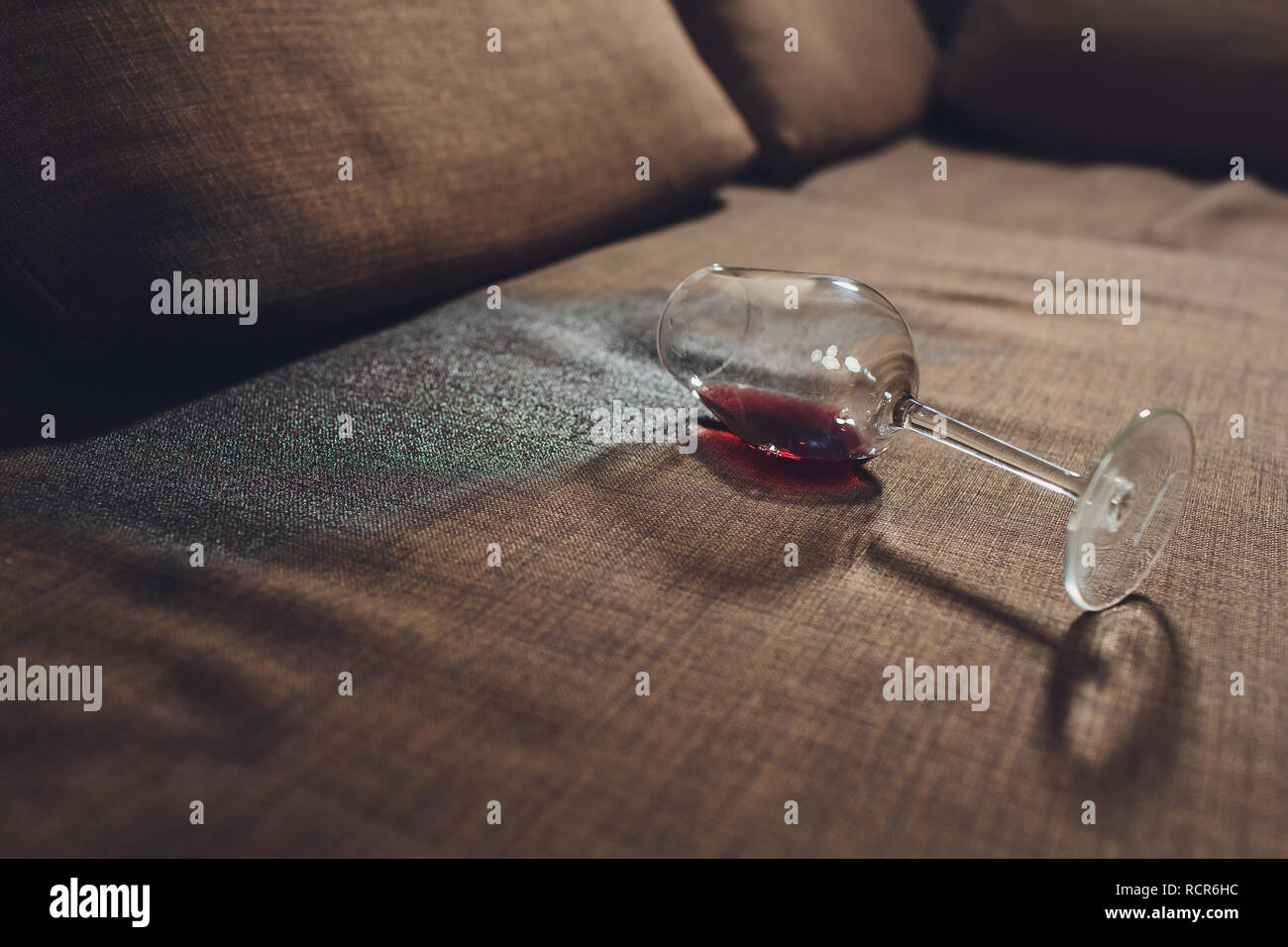 Red Wine Spilled On A Grey Couch Sofa Stock Photo 231620744 Alamy