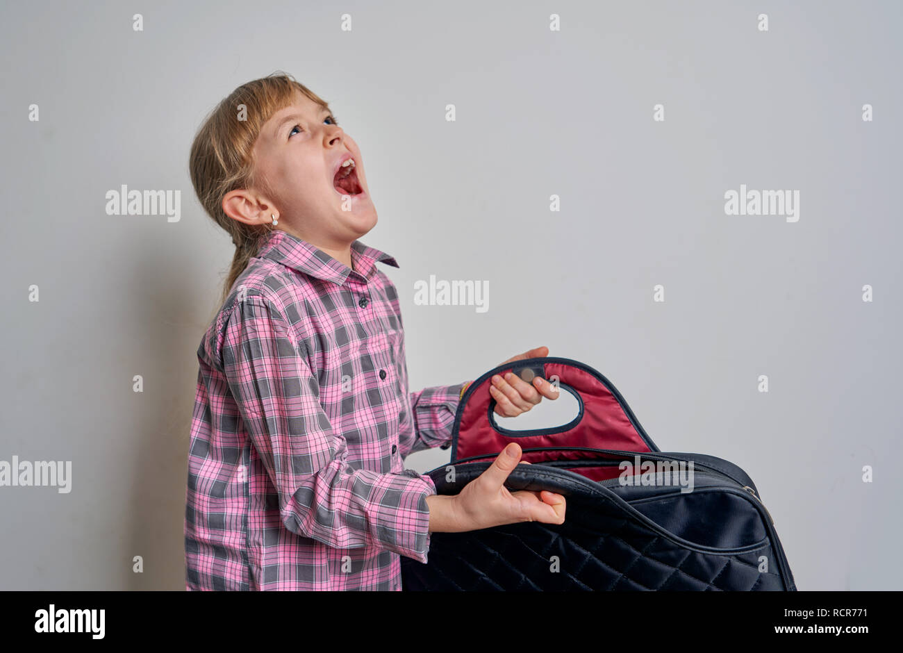 girl with briefcase on white background Stock Photo Alamy