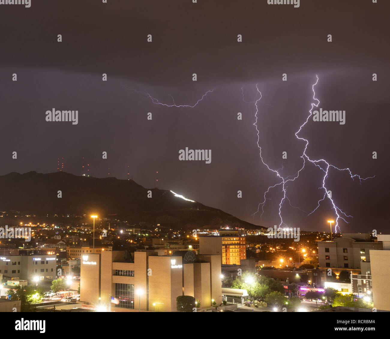 Lightning At The Foot Of The Franklin Mountains With The Star On The Mountain Visible El Paso Texas Stock Photo Alamy