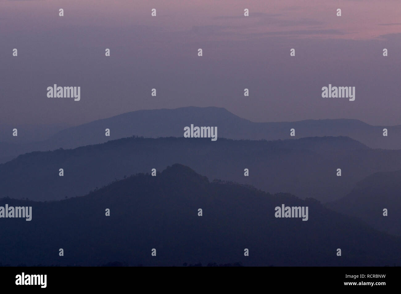 India Munnar.  Sunset over the mountains and hills. Stock Photo