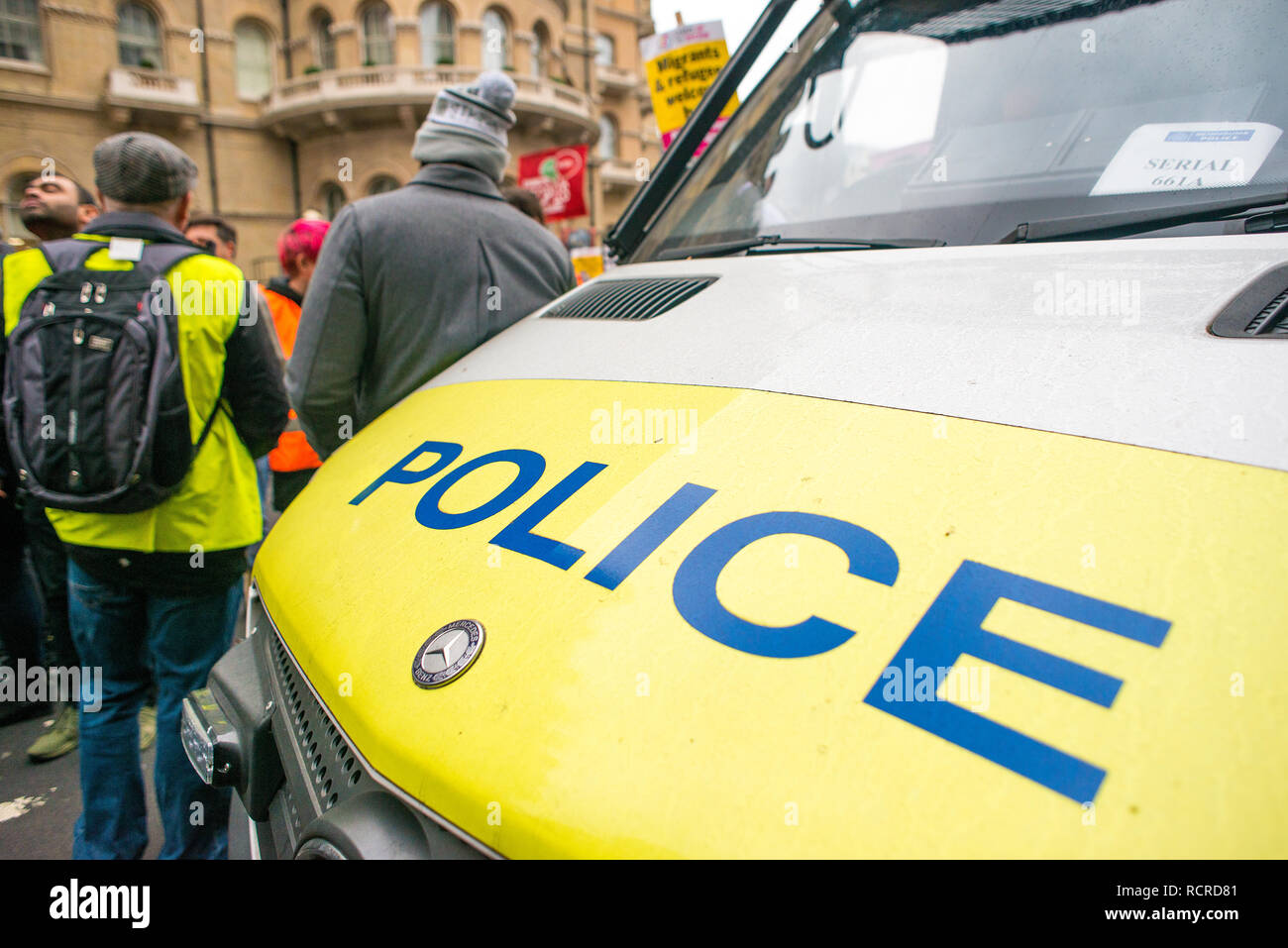 Police patrol van creates roadblock in central London, to stop all oncoming traffic, ahead of a nearby street demonstration, to ensure public safety. Stock Photo