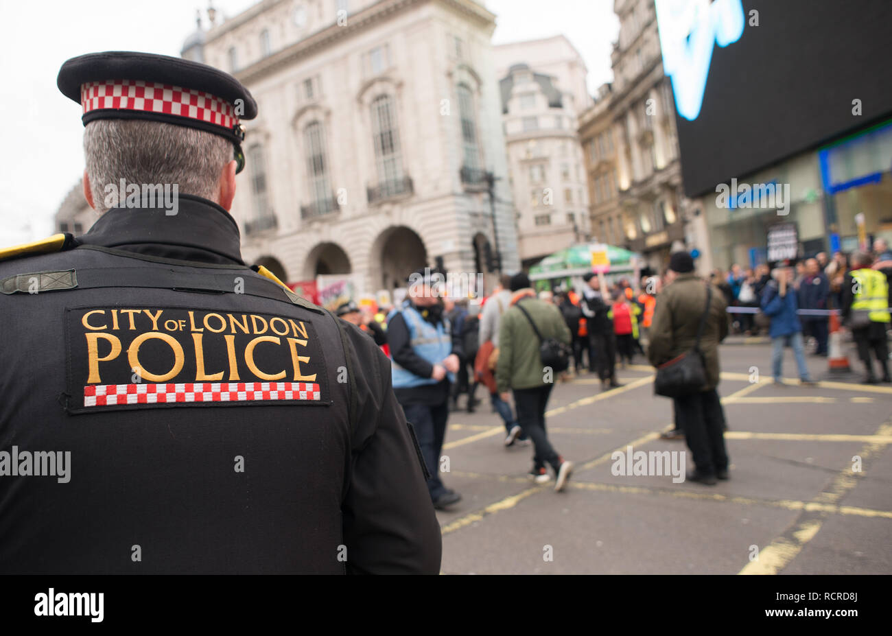 City of London police officers escorting & monitoring the Britain Is Broken - General Election Now street demonstration through central London, UK. Stock Photo