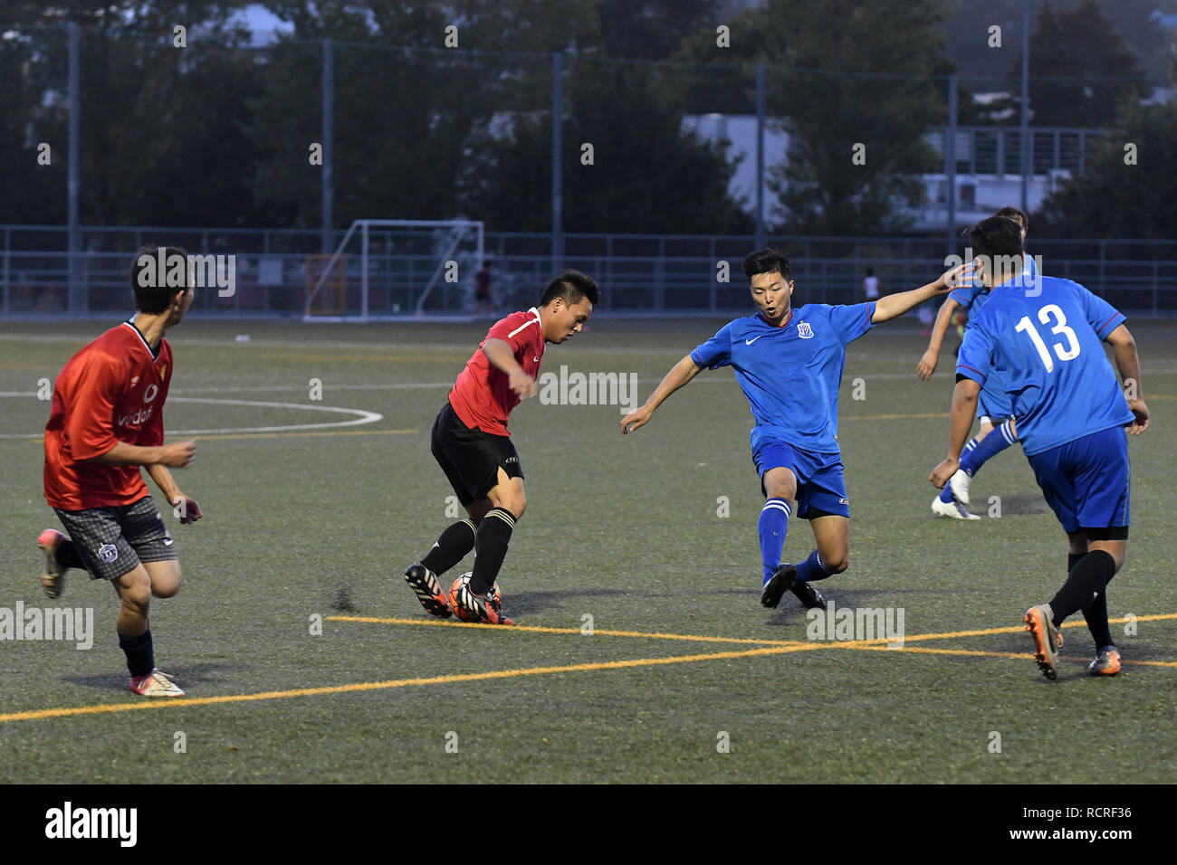 2 Chinese Teams having a friendly match in the evening Stock Photo