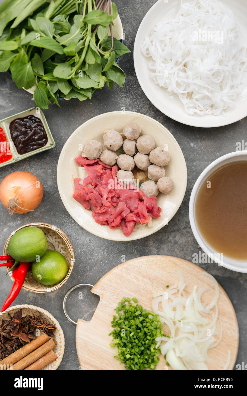 Traditional vietnamese noodle soups pho in bowls, concrete background