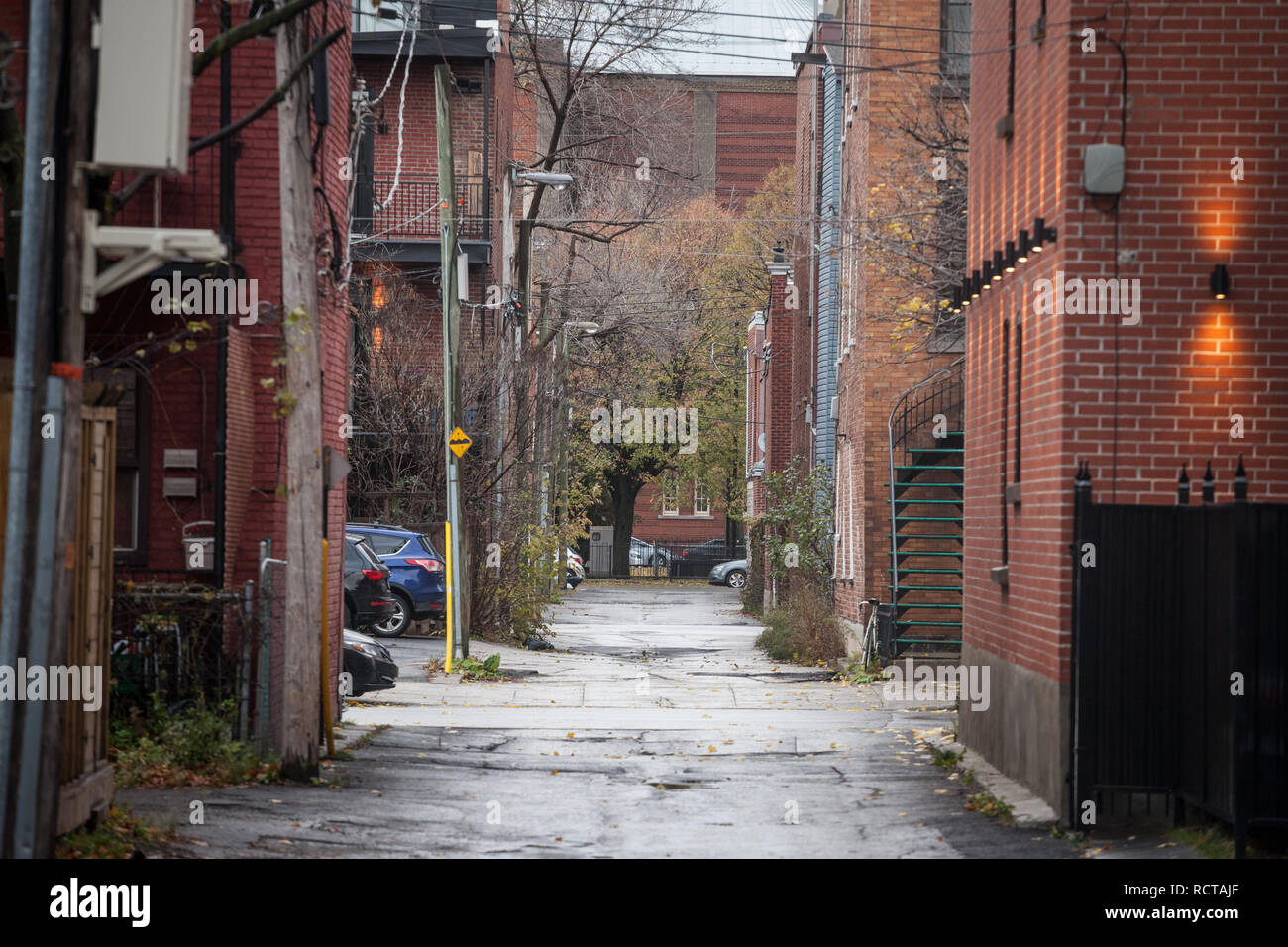 MONTREAL, CANADA - NOVEMBER 6, 2018:  typical north American middle income residential street in autumn in Montreal, Quebec, during a rainy day, with  Stock Photo