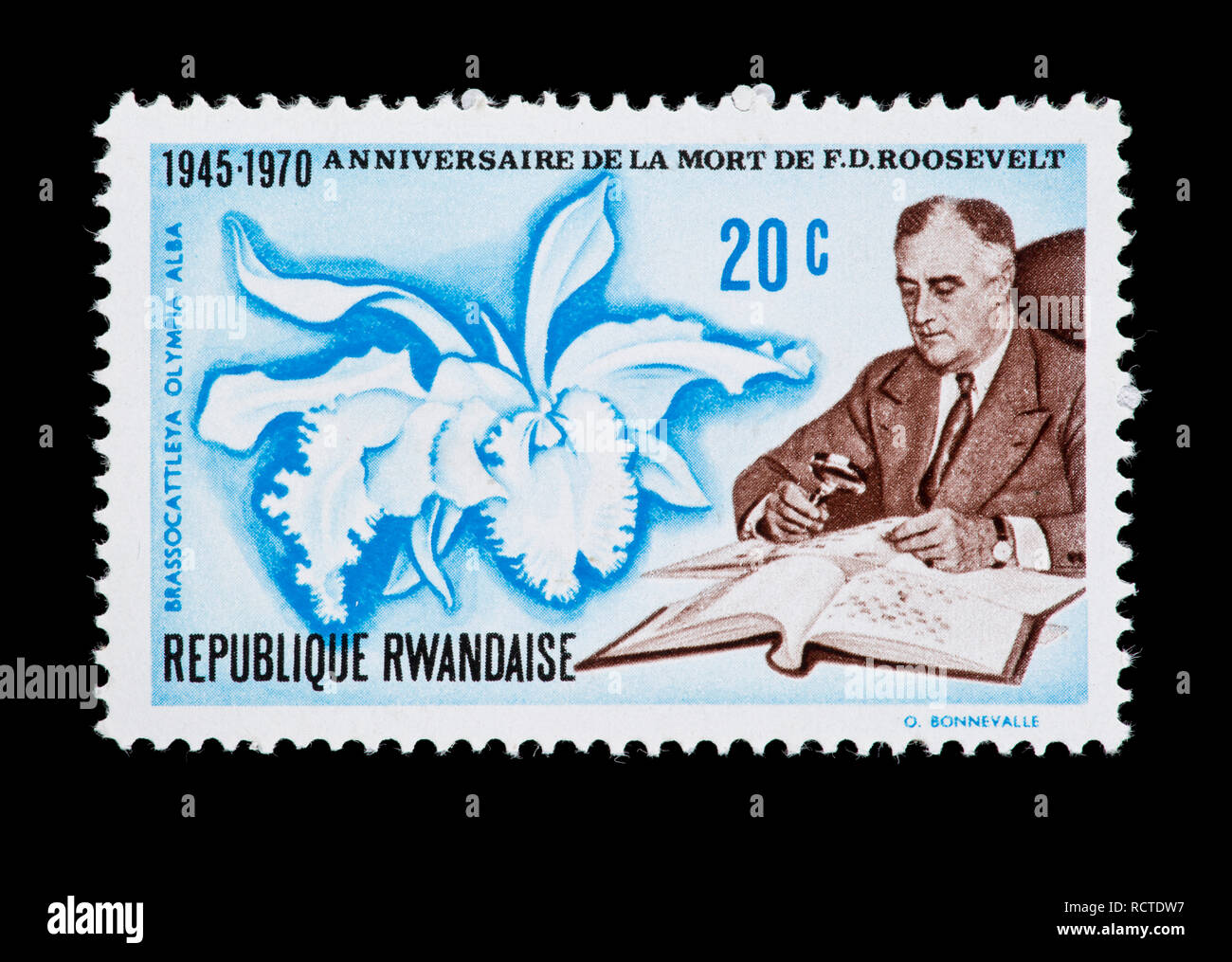 Postage stamp from Rwanda depicting Franklin Delano Roosevelt on the 25th anniversary of his death and an orchid Stock Photo