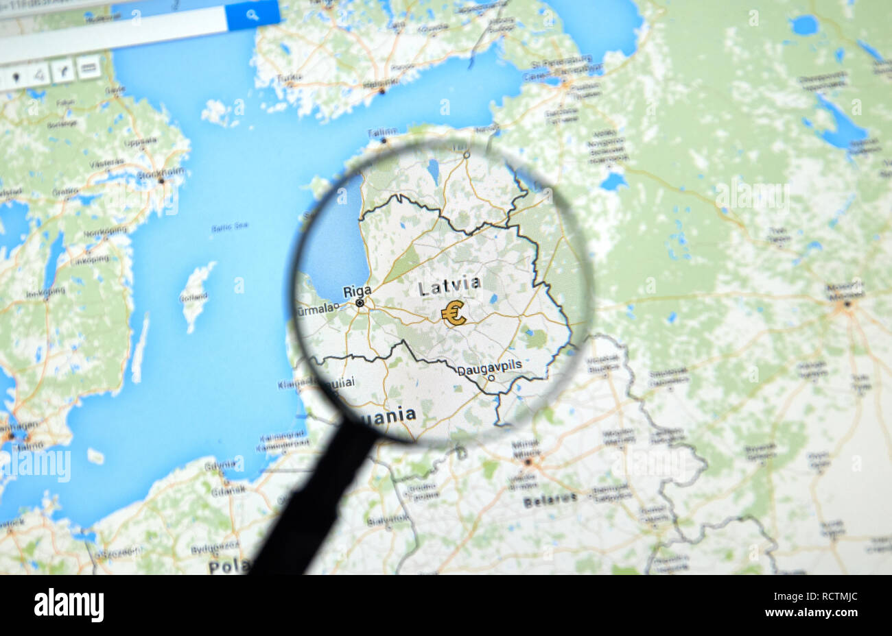 MONTREAL, CANADA - JUNE 24, 2016 - Latvia on Google Maps app under magnifying glass. Latvia is a european country and a member of EU. Stock Photo