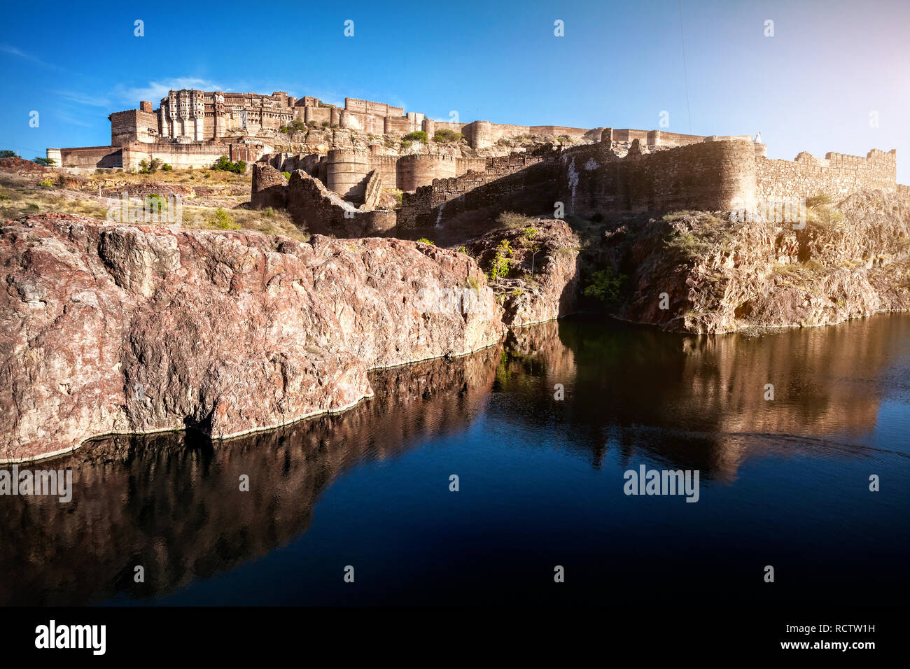 Mehrangarh fort on the hill near the pond at blue sky in Jodhpur, Rajasthan, India Stock Photo