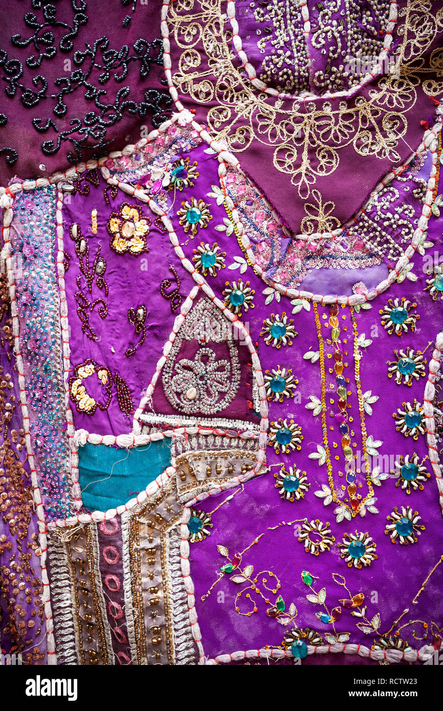 Purple ethnic Rajasthan cushion with mirrors on flea market in India Stock Photo