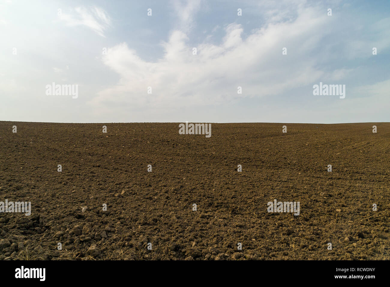 Dirt field ready for spring planting Stock Photo - Alamy