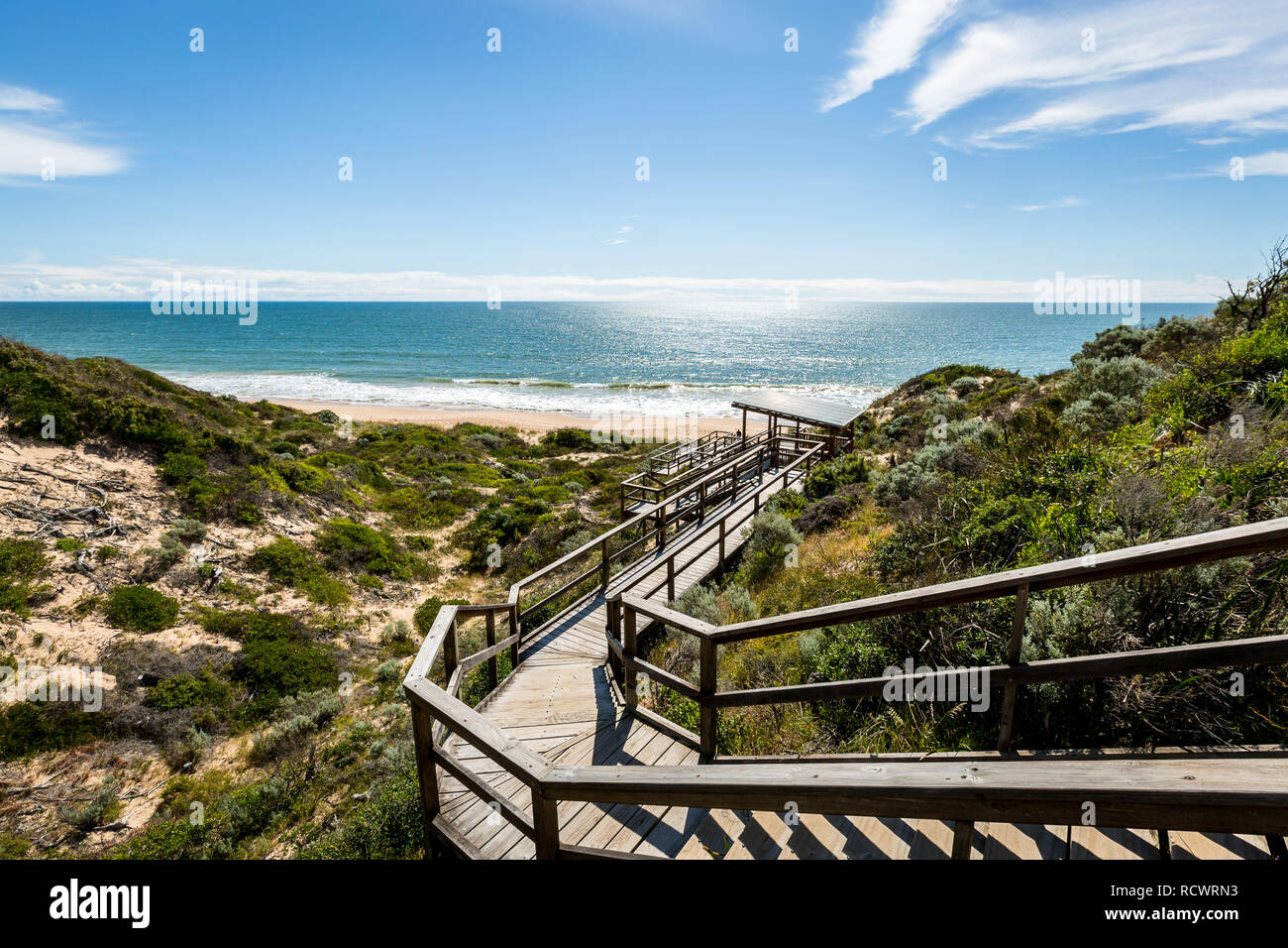 Beautiful bright spring day view towards beach over looking wooden walk way Dalyllup Western Australia Stock Photo