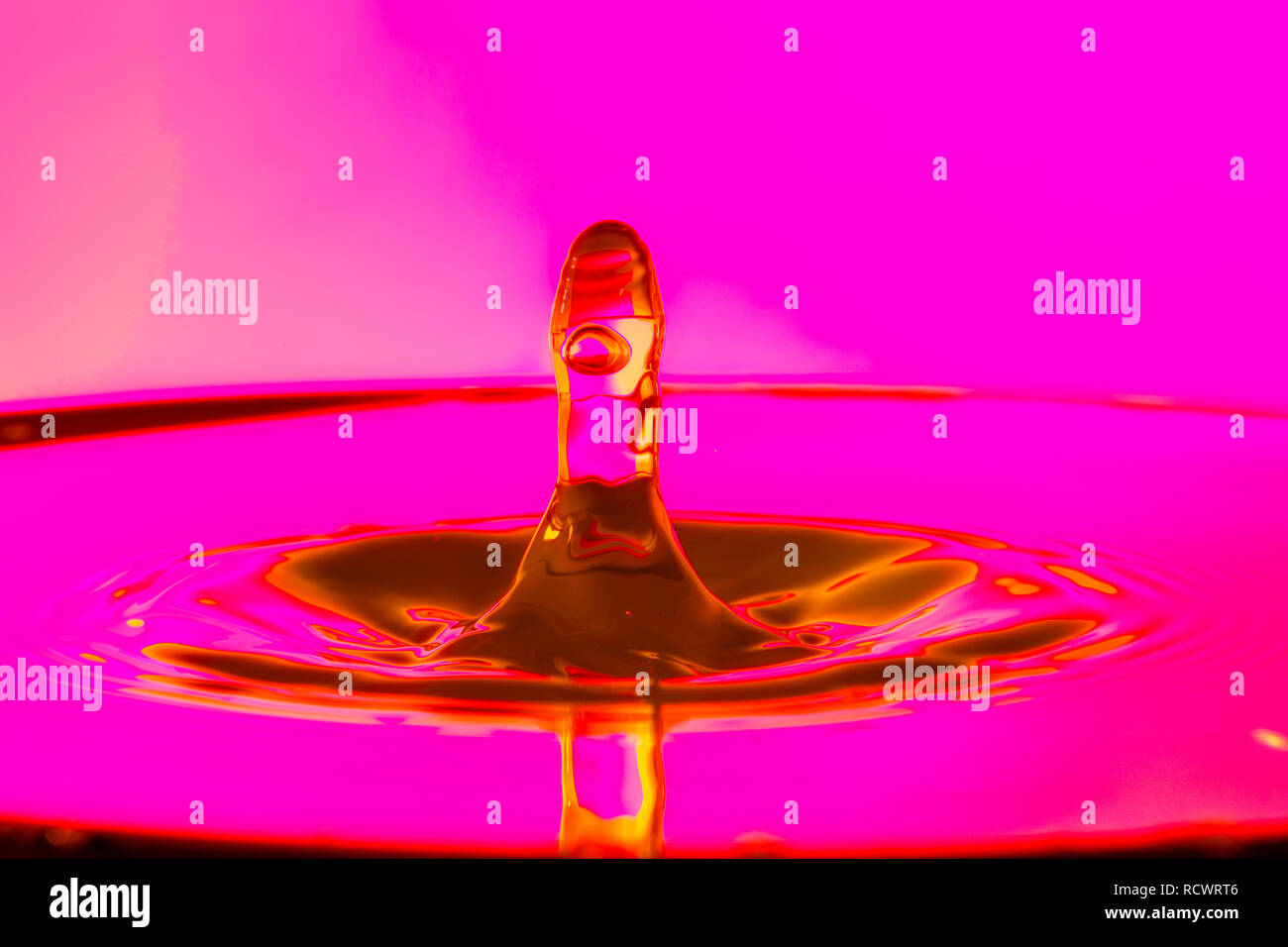Orange Water Splash with Pink Backlight Stock Photo Alamy